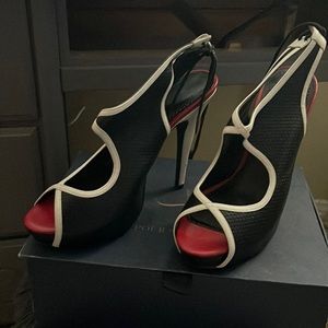 Black w/ white and red heels. Size 10